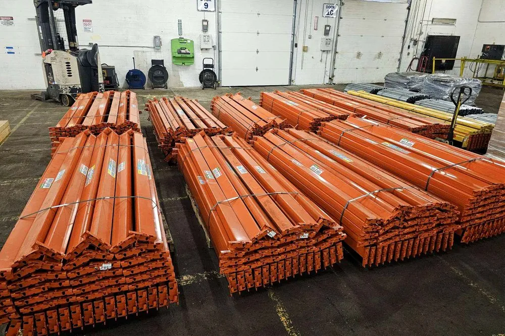 Pallet rack beams banded and labelled on a loading dock